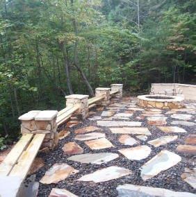 Stone pavers, fence supports, and fire pit