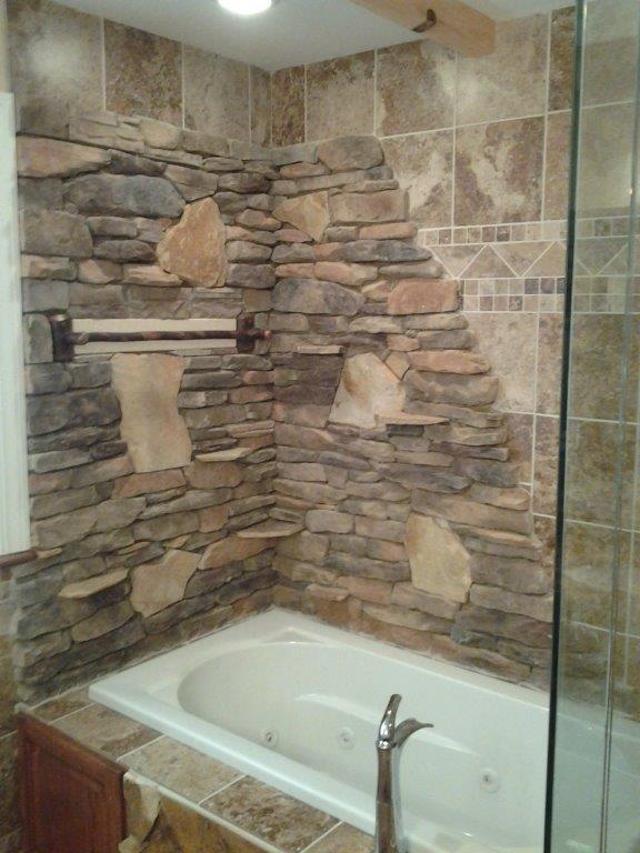 Faux stone and tile wall with Jacuzzi