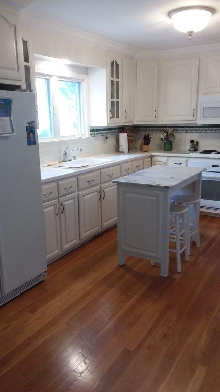 Finished kitchen 7 - White maple cabinets with white marble top and pine wood flooring. 